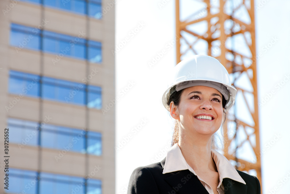 Smiling woman working on construction Smiling woman working on construction