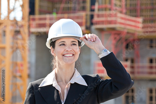 Woman holding hard hat