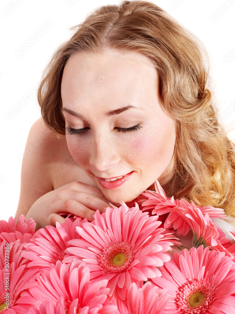 Happy young woman holding flowers.