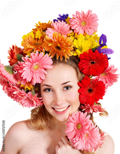 Young woman with with flowers on her hair.