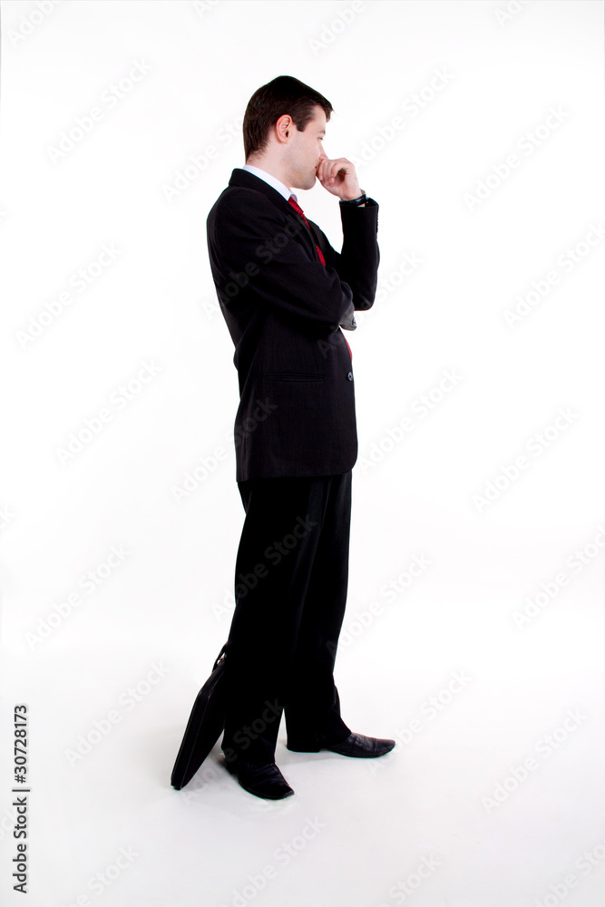 Full length of young business man standing with suitcase Full length of young business man standing with suitcase
