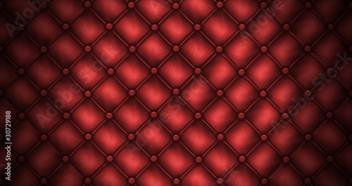 Texture leather quilted a sofa. Red color © Olga Galushko