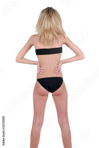 Beautiful young woman l. Rear view.