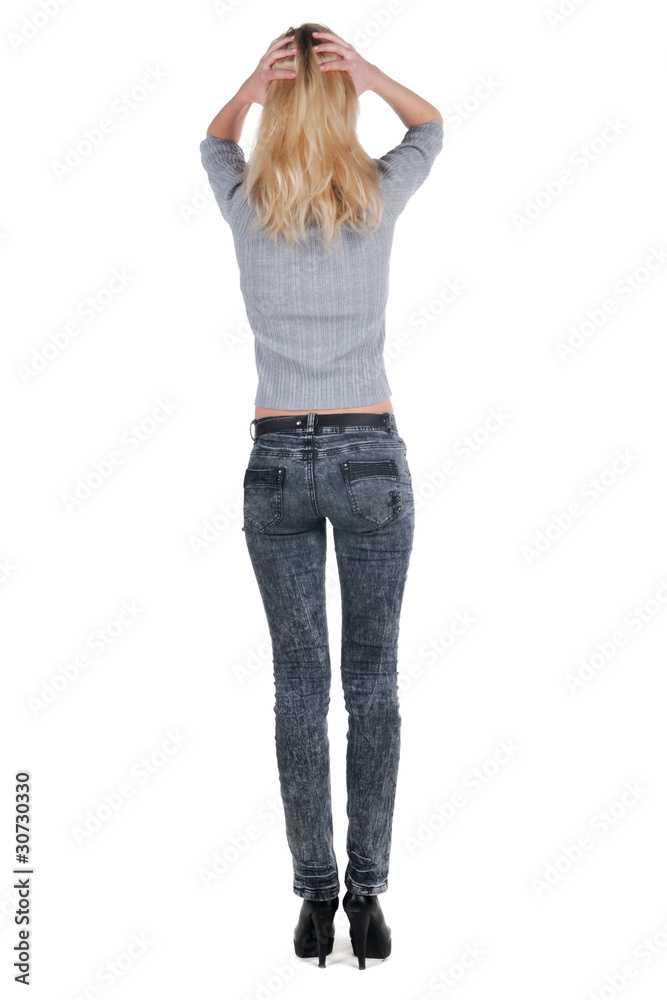Beautiful young woman looking at wall. Rear view. Beautiful young woman looking at wall. Rear view.