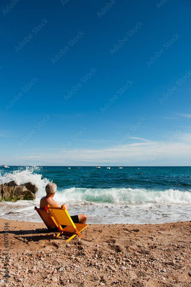 Elderly man at the beach