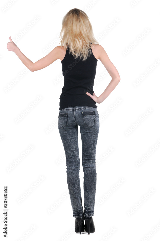 Beautiful young woman looking at wall. Beautiful young woman looking at wall.
