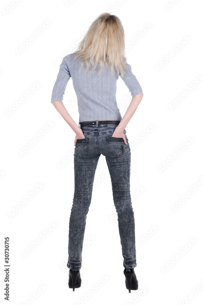 Beautiful young woman looking at wall. Rear view. Beautiful young woman looking at wall. Rear view.