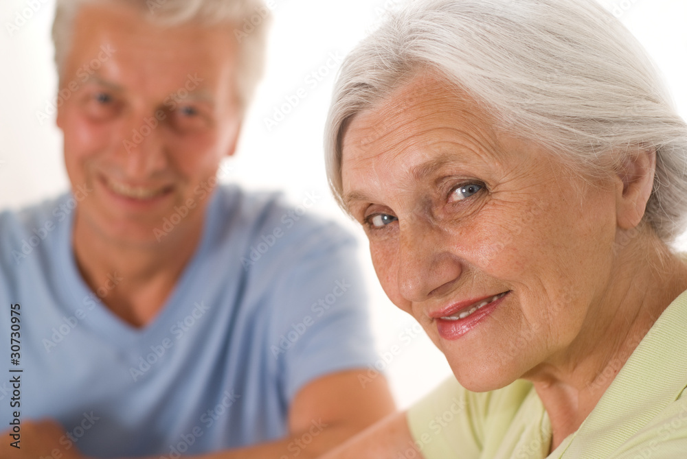 elderly couple on a white elderly couple on a white