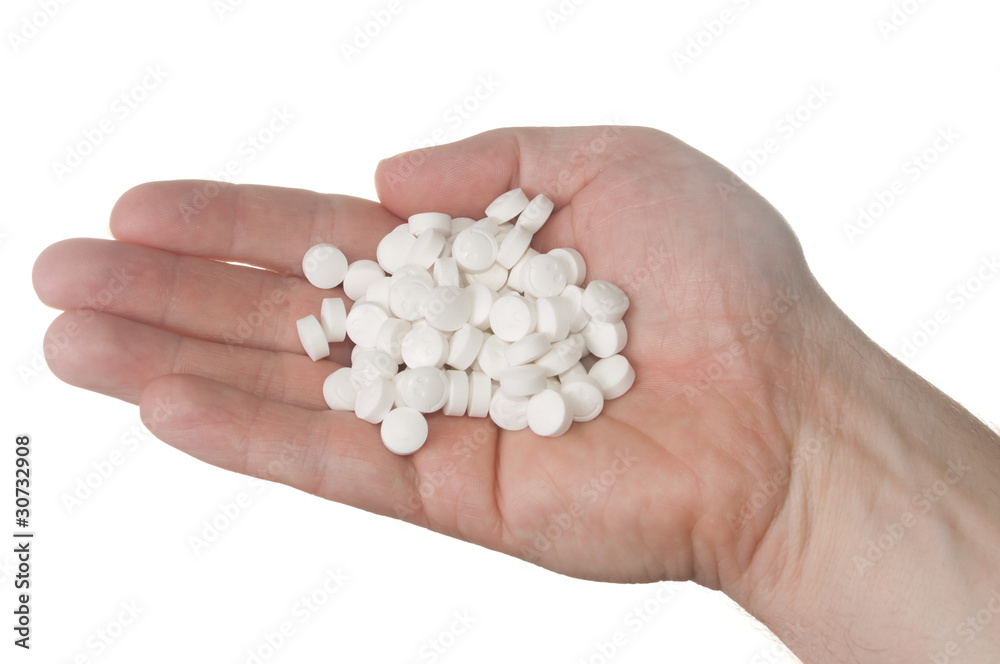 One handfull of pills shaped as a smiley