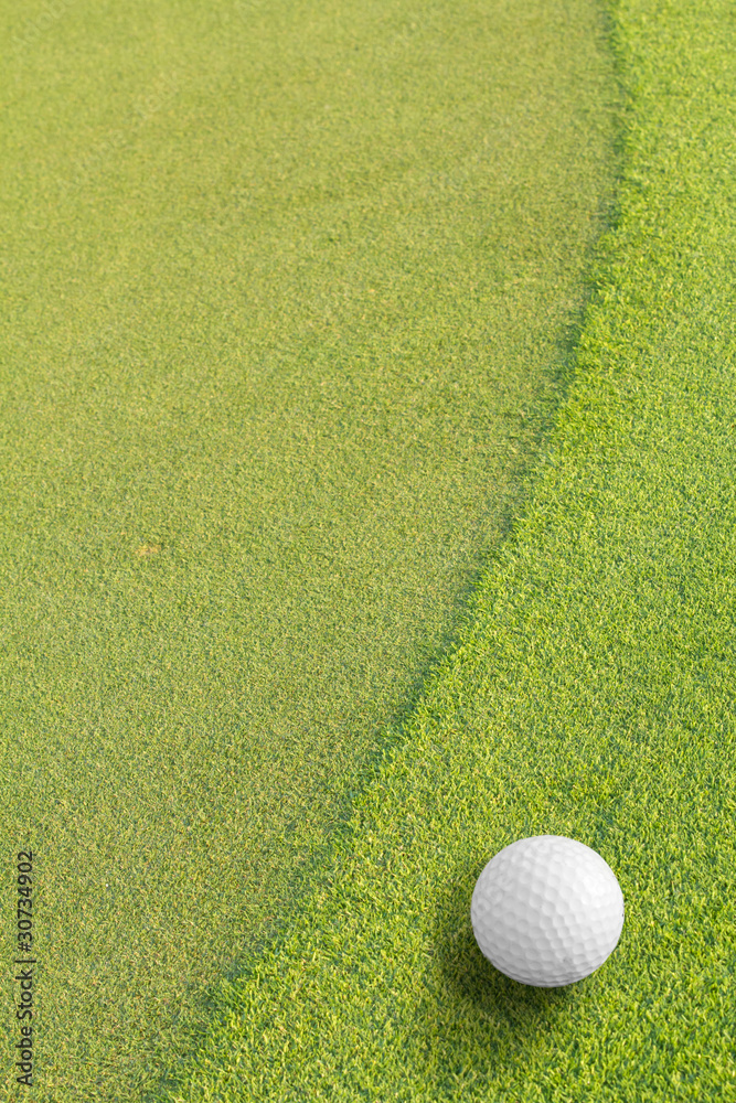 Golf ball on green tee Golf ball on green tee