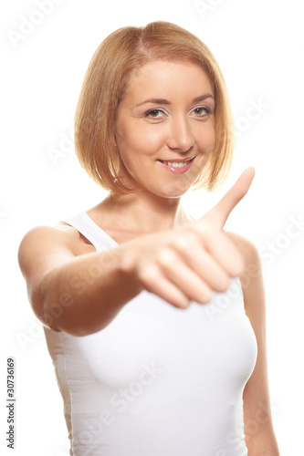 Young woman on white, showing thumbs up