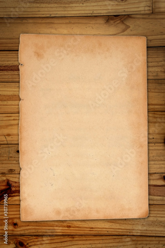 Empty white Crumpled paper on wood table vertical