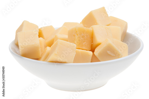 blocks of cheese in a bowl isolated
