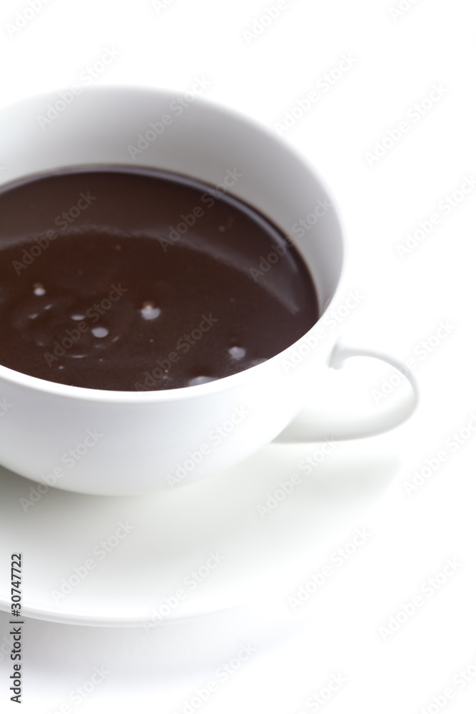 melted chocolate in a cup isolated on white melted chocolate in a cup isolated on white