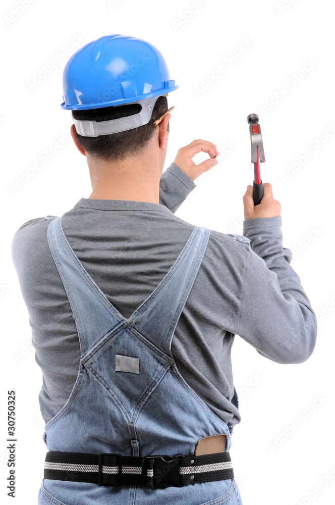 Carpenter nailing the wall with hammer isolated on white. Carpenter nailing the wall with hammer isolated on white.