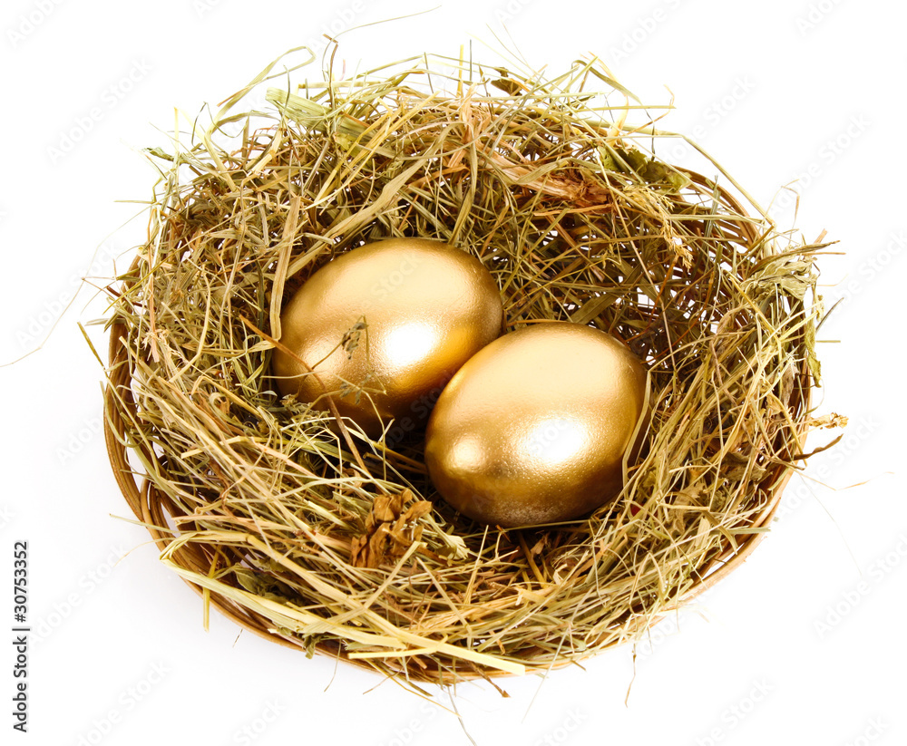 Three golden hen's eggs in the grassy nest isolated on white Three golden hen's eggs in the grassy nest isolated on white