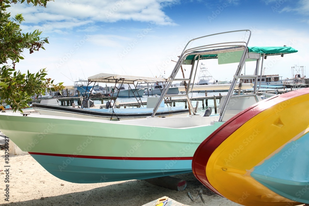 boats colorful in Isla Mujeres beach Mexico