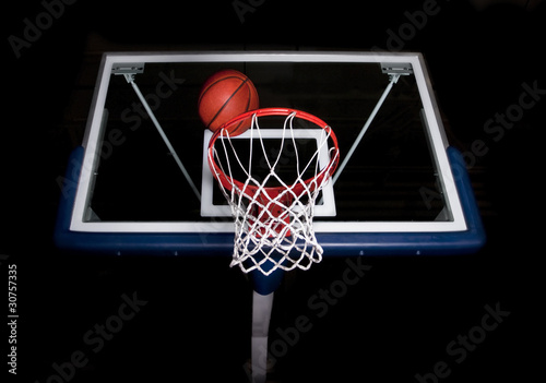 Basketball basket on black background © Brocreative