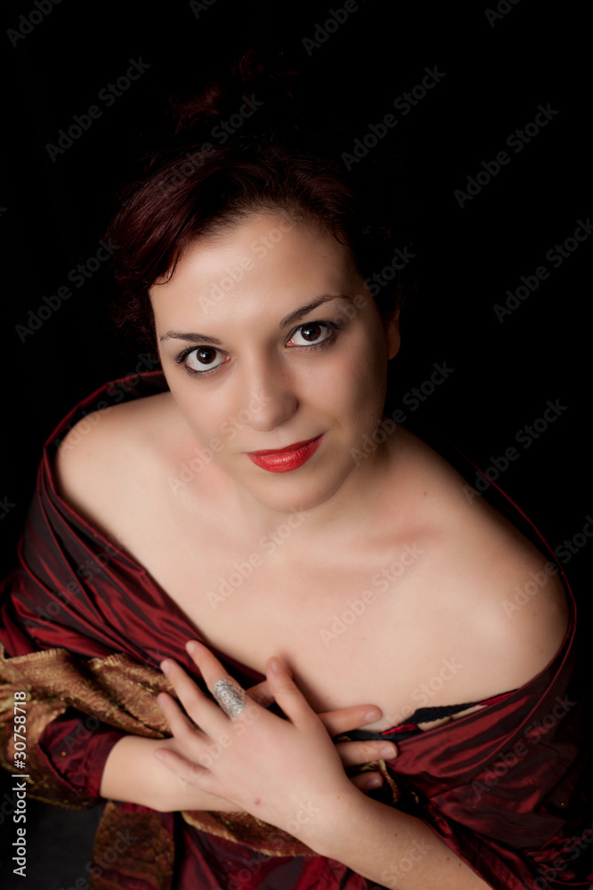 Attractive young woman smiling, wearing elegant retro dress Attractive young woman smiling, wearing elegant retro dress