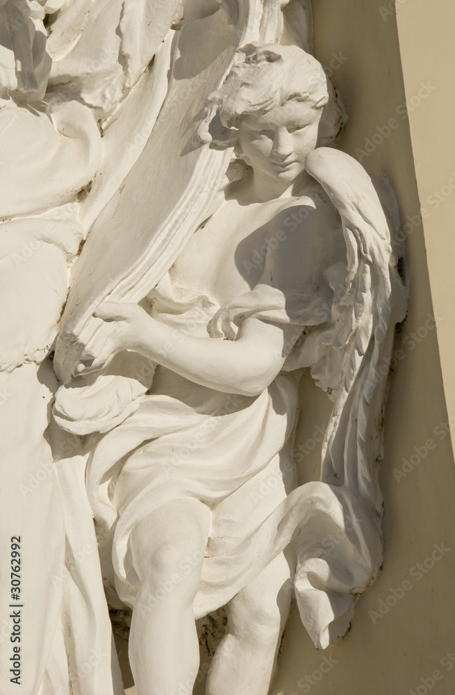 Naklejka premium angel sculpture fragment