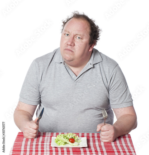 gros homme au régime salade photo