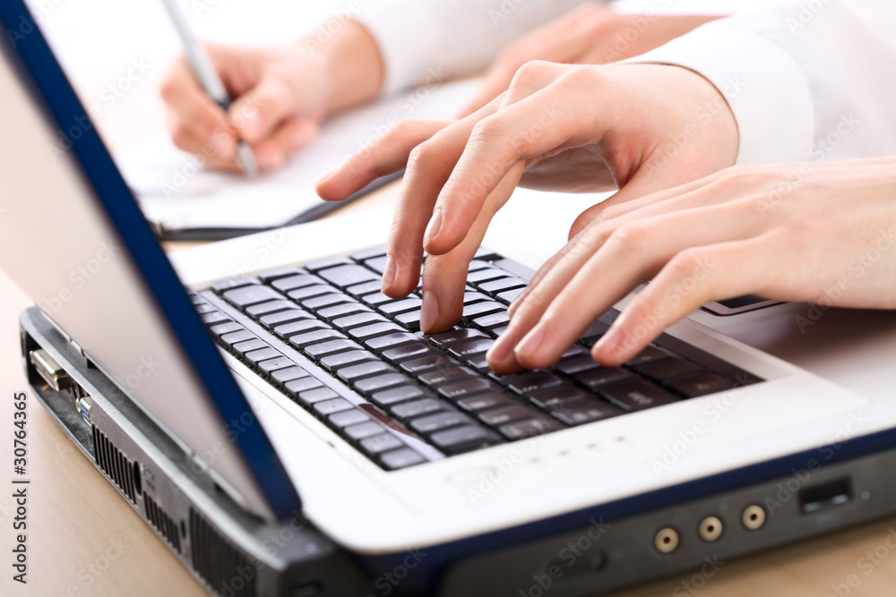 Human hands pressing keys Human hands pressing keys