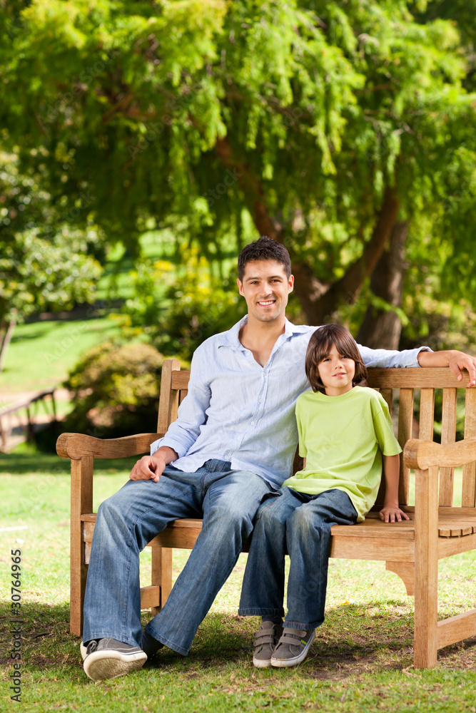 Father with his son on the bench Father with his son on the bench
