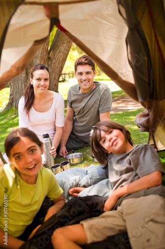 Happy family camping in the park