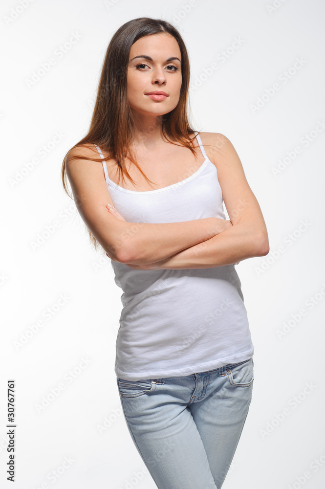 Portrait of a happy young healthy woman standing over white back Portrait of a happy young healthy woman standing over white back