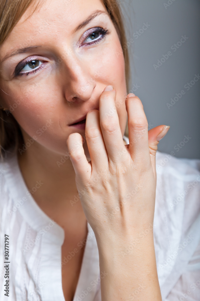 Depressed, sad woman on neutral background Depressed, sad woman on neutral background