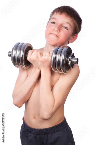 Tennager lifts heavy dumbbell photo