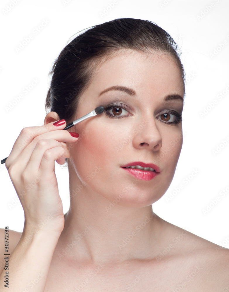 Woman applying make-up