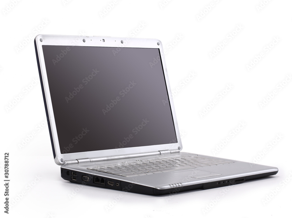 A modern laptop computer and wireless mouse with A modern laptop computer and wireless mouse with