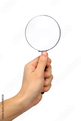 Magnifying glass in hand isolated on white background