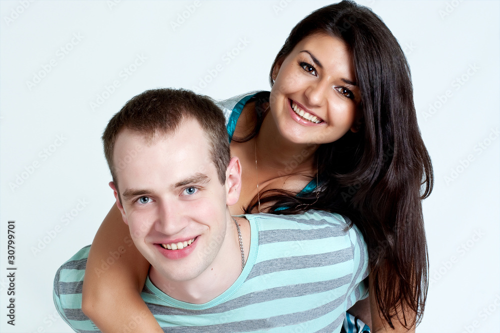 Happy young coule smiling at camera on white background Happy young coule smiling at camera on white background