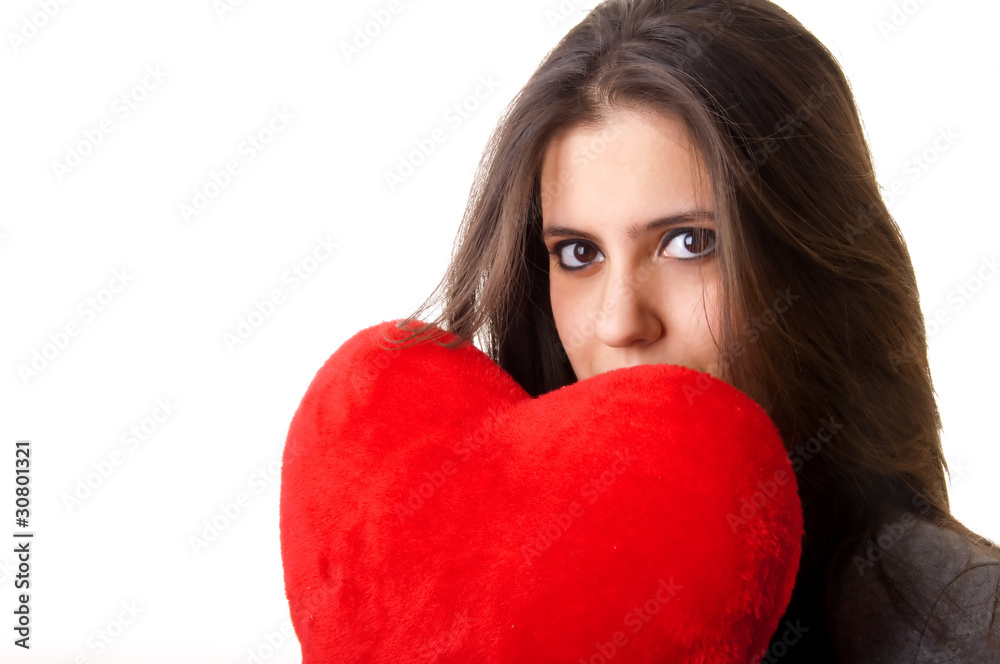 Woman holding a red heart with sexy expression Woman holding a red heart with sexy expression