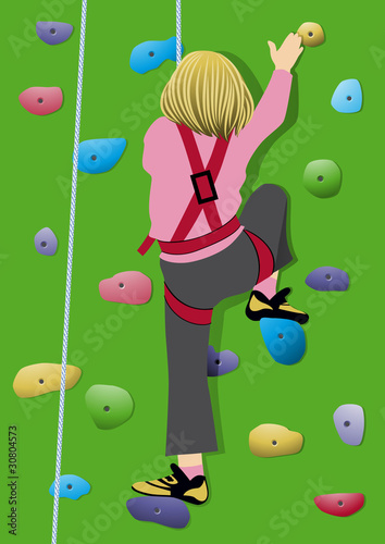 Girl climbing artificial rock