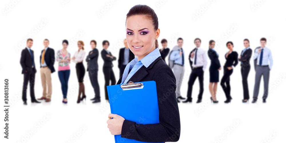 Leader holding a clipboard, business team behind Leader holding a clipboard, business team behind