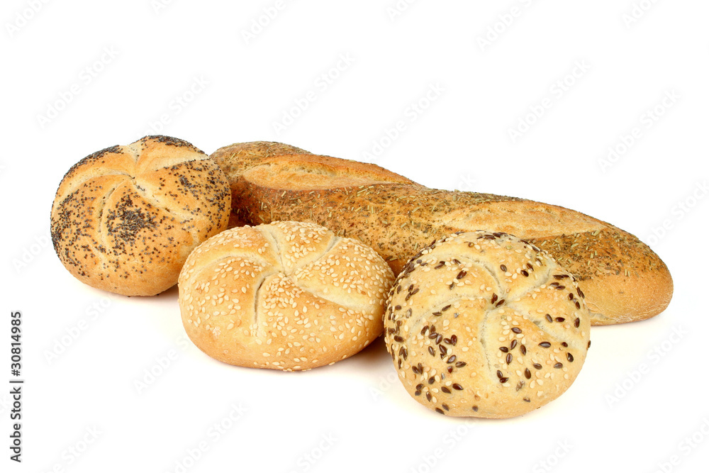 Kaiser rolls with poppy and sesame seeds and a loaf of bread wit Kaiser rolls with poppy and sesame seeds and a loaf of bread wit