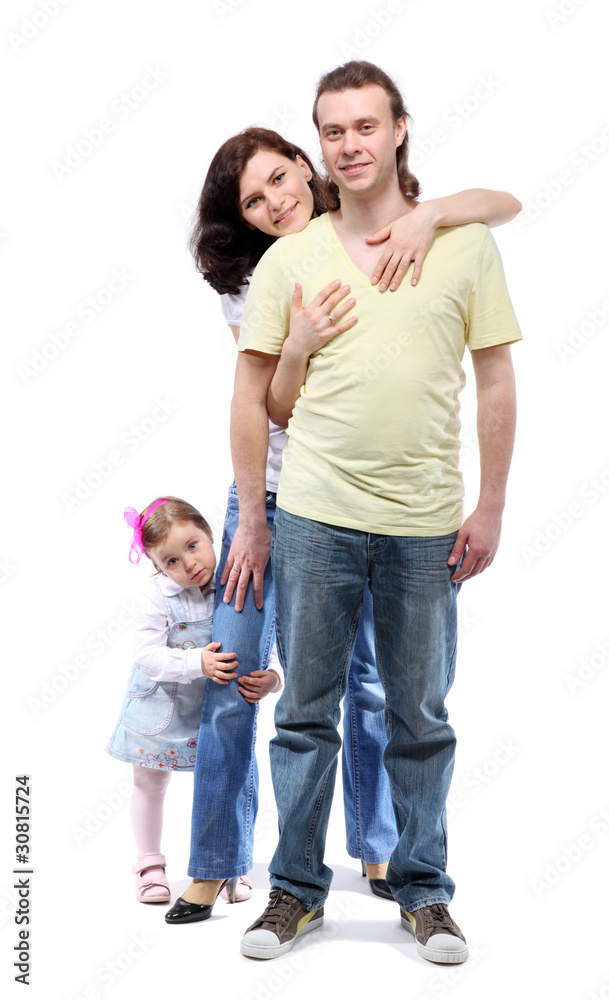 Young family - mother, father and daughter - are standing Young family - mother, father and daughter - are standing