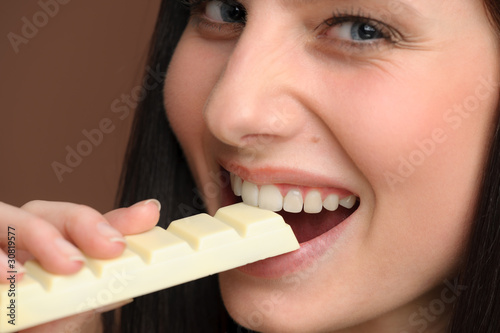 Chocolate - close-up of young woman enjoy sweets