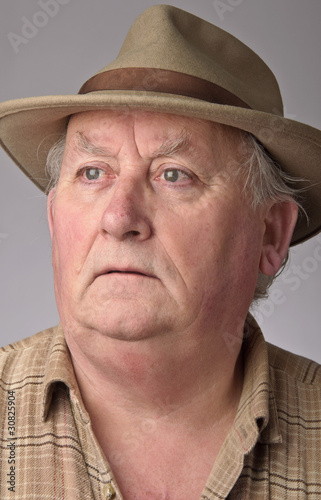 portrait of senior male wearing a hat