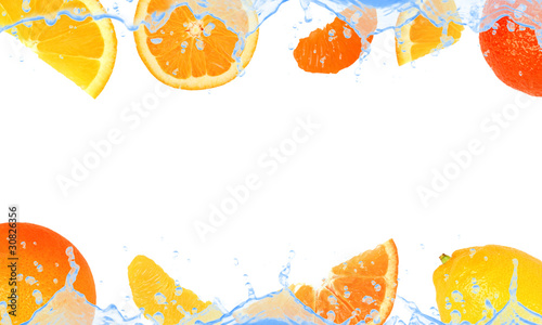Citrus fruit with splash isolated on white