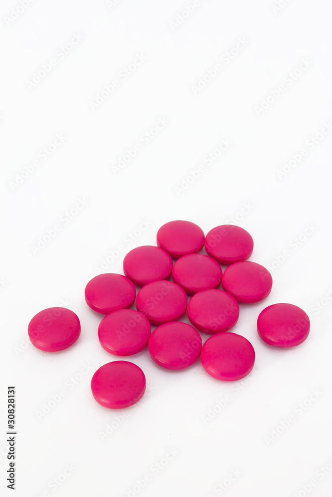 Real pink medicine pill drug tablet group on white background Real pink medicine pill drug tablet group on white background