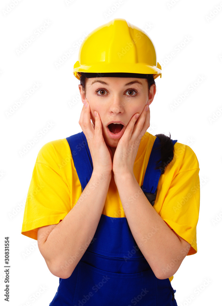 Construction girl holding her face in astonishment Construction girl holding her face in astonishment