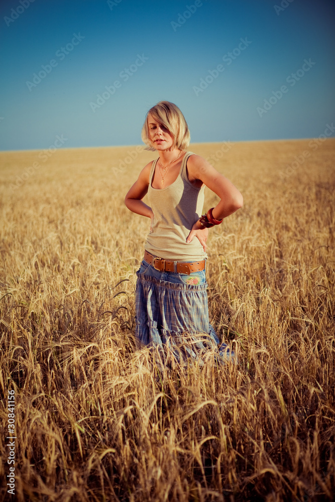 Image of young woman on wheat field Image of young woman on wheat field