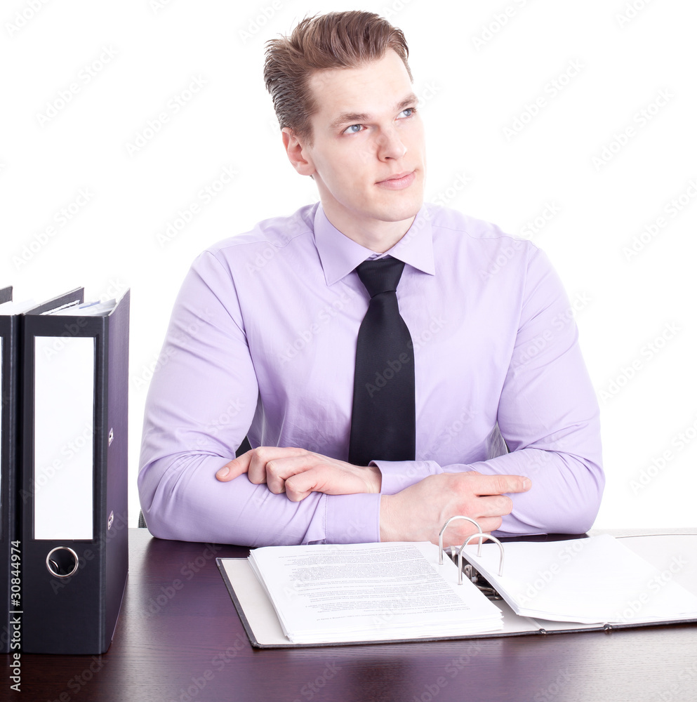 Businessman sitting in his office contemplating, isolated