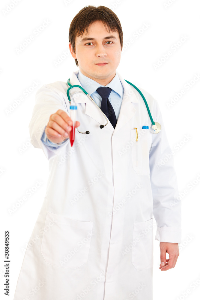 Concentrated medical doctor holding blood sample in hand Concentrated medical doctor holding blood sample in hand