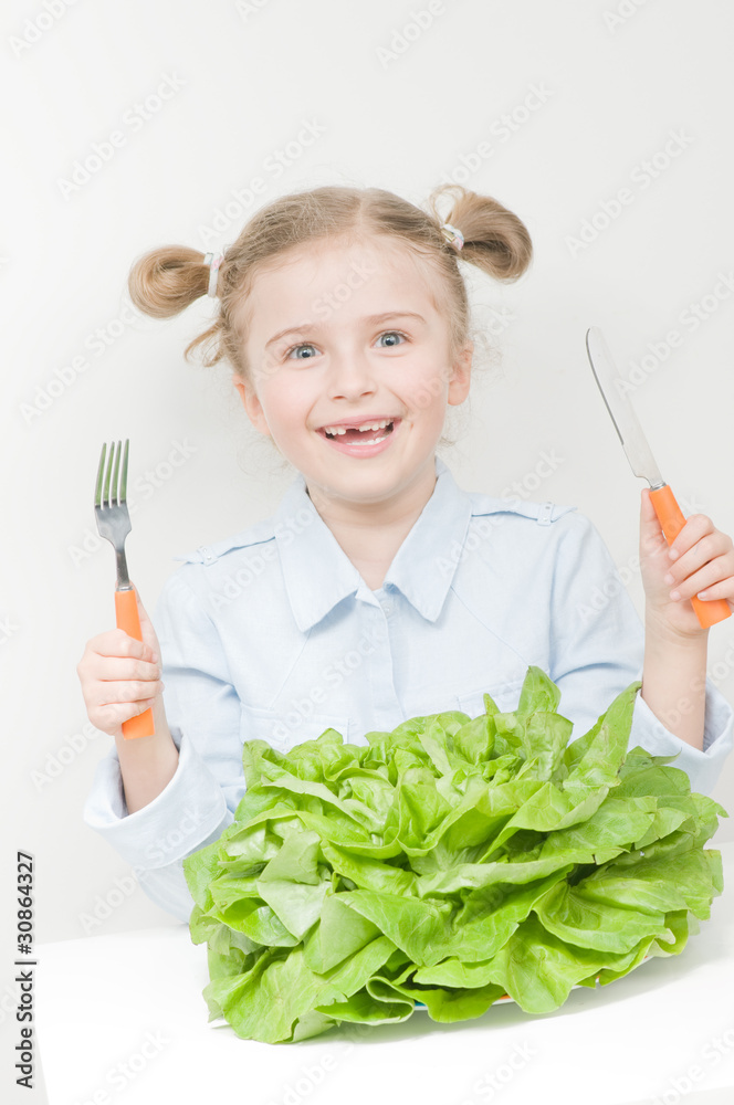 Healthy food - little girl with butterhead lettuce