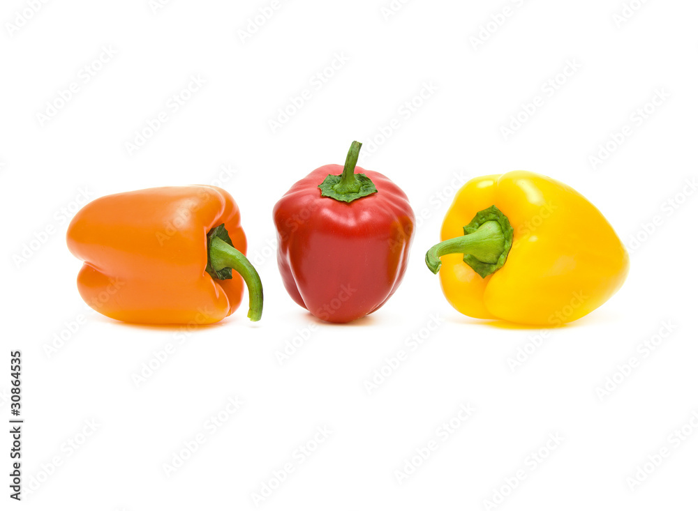 peppers of different colors on a white background peppers of different colors on a white background